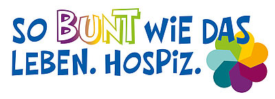 Schriftzug "So bunt wie das Leben. Hospiz." Die Buchstaben des Wortes "bunt" sind in unterschiedlichen Farben, der Rest ist blau. Daneben eine stilisierte Blüten mit verschiedenfarbigen Blütenblättern.